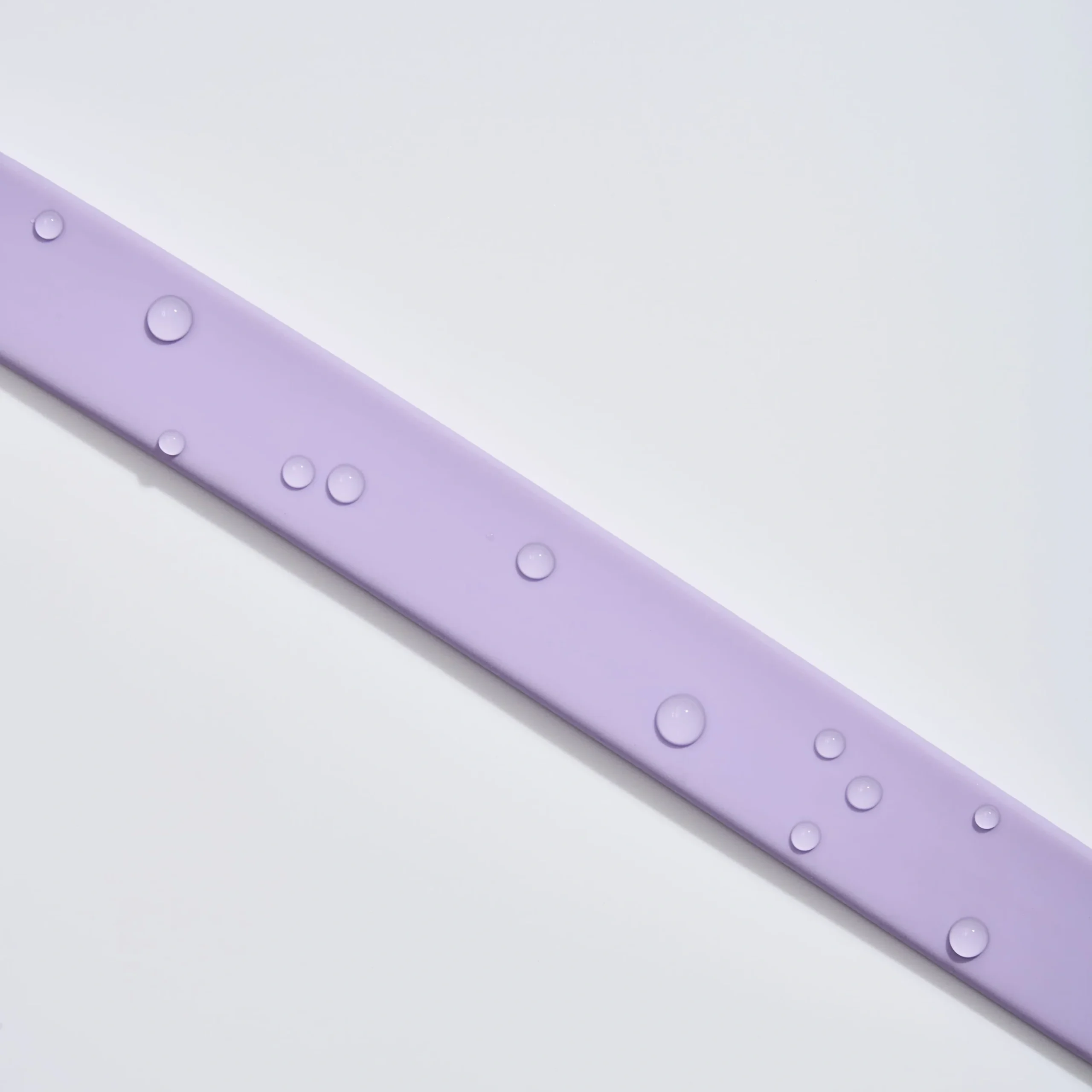 MoonianPet coated webbing waterproof close-up — water beading off the sealed surface instantly