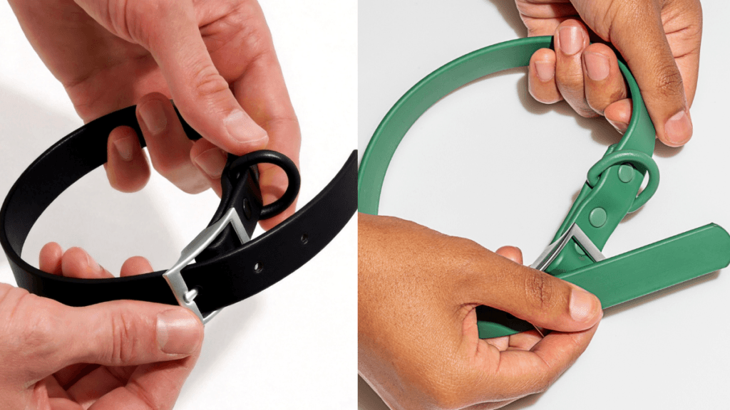 MoonianPet waterproof dog collar in black and green hand detail — BioThane-style PVC-coated webbing collar showing material texture and zinc alloy hardware